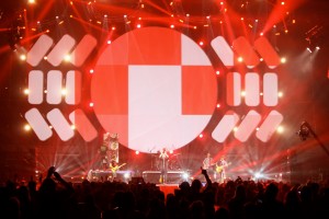 The stage backdrop at YC:A2014. Featuring a large circular screen and 18 smaller panels. Projected on by 2 20,000 Watt projectors layered on each other.